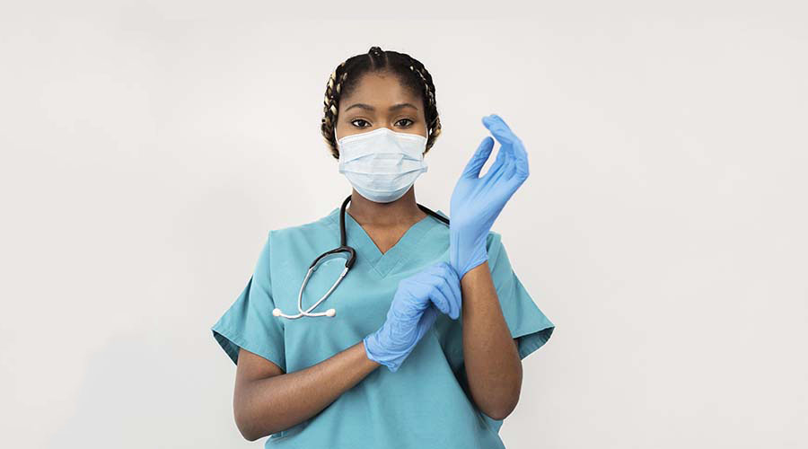 image-of-a-caregiver-woman-wearing-gloves-at-Paula-training-institute.