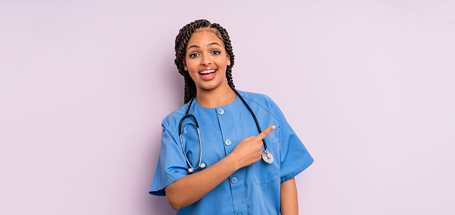 looking excited and surprised pointing to the side. how to become a caregiver in kenya.