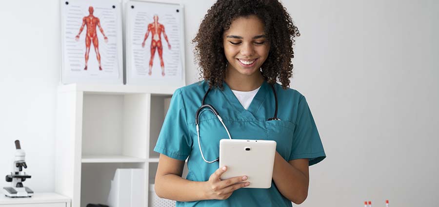 young caregiver woman using a tablet to learn caregiver course online.