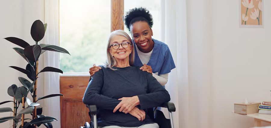young-female-caregiver-with-senior-woman-with-wheelchair-smiling-offering-caregiver-services-at-home. best short medical courses in Kenya