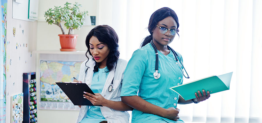 two-african-CNA-working-at-a-hospital-african-healthcare.